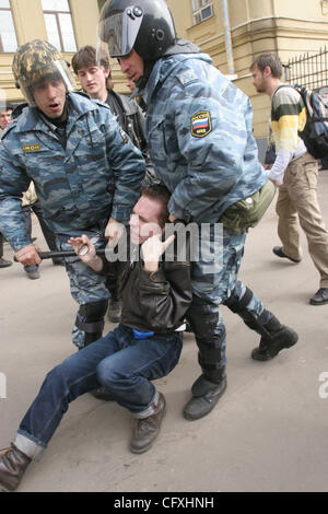 Riot police OMON arresting participants of the `Dissenters` March in St.Petersburg. Protesters shouted for St.Petersburg`s Governor Valentina Matviyenko to resign and called President Vladimir Putin an enemy of the state. Stock Photo